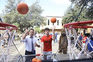 President Sanford & University of Dallas student shooting hoops